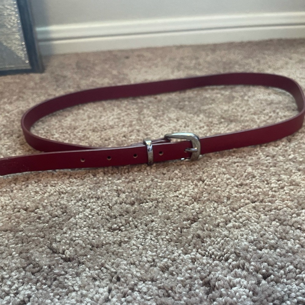 Women’s red belt with silver buckle